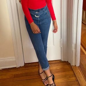 High waisted, belted blue jeans